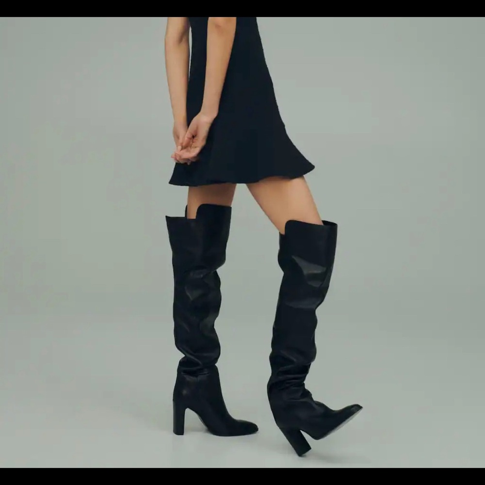 Brand new thigh high black leather boots